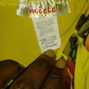 A knee length, large print flowered dress.